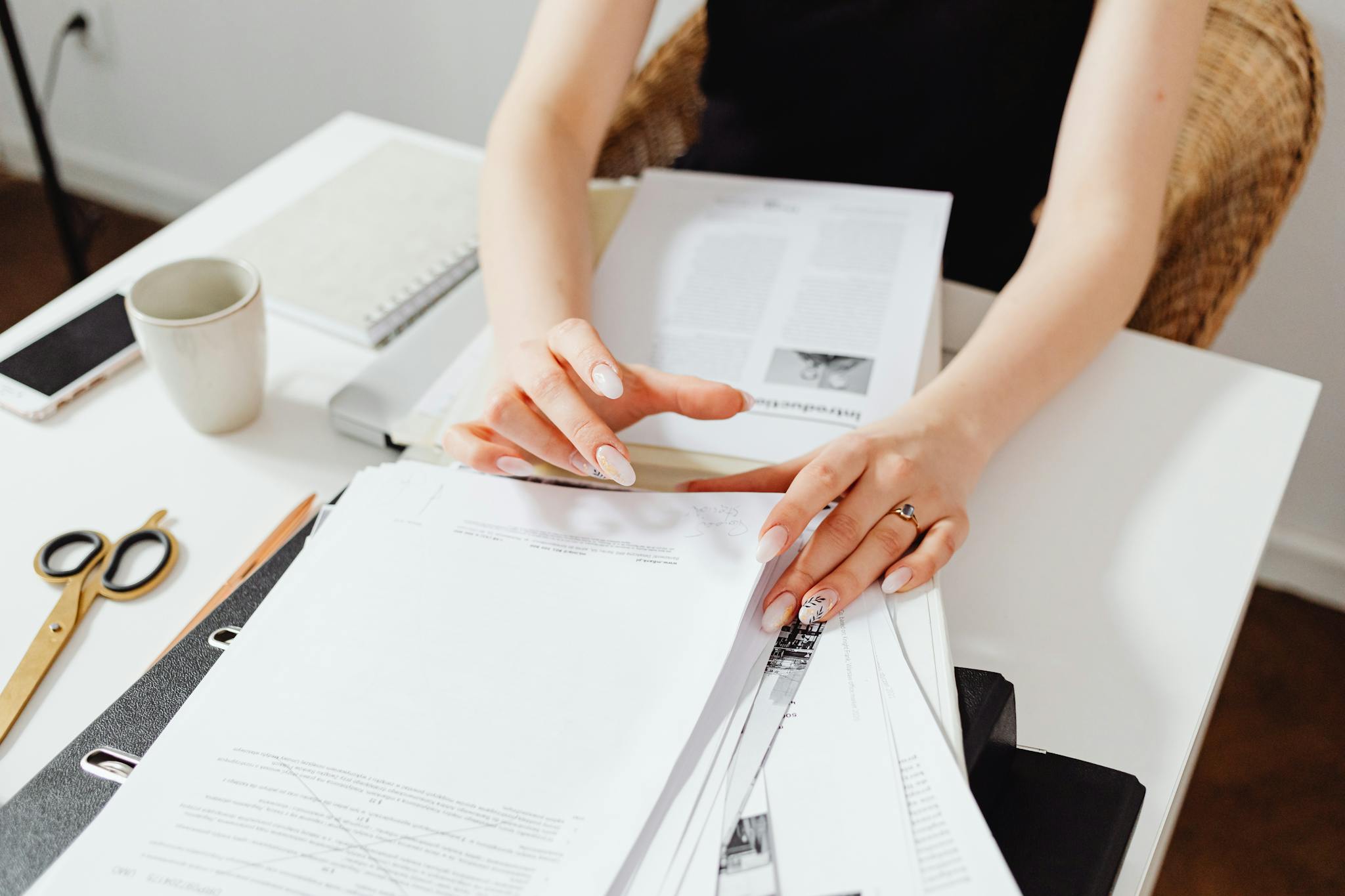 Efficient paper organizing and management in a home office setting.